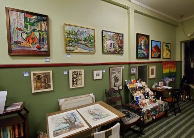 the interior of the Yiddishland building filled with artwork and books