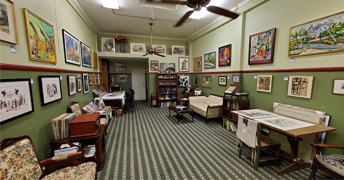 the interior of Yiddishland California's building containing an assortment of artwork