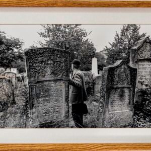 Man Visiting Cemetery by Yale Strom