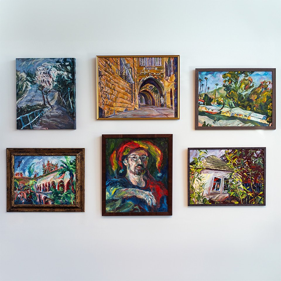 6 different framed paintings on the wall