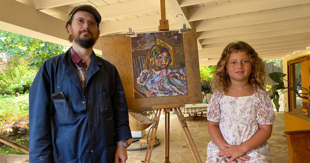 oleg tsank and esterke are posing in front of a portrait of esterke.